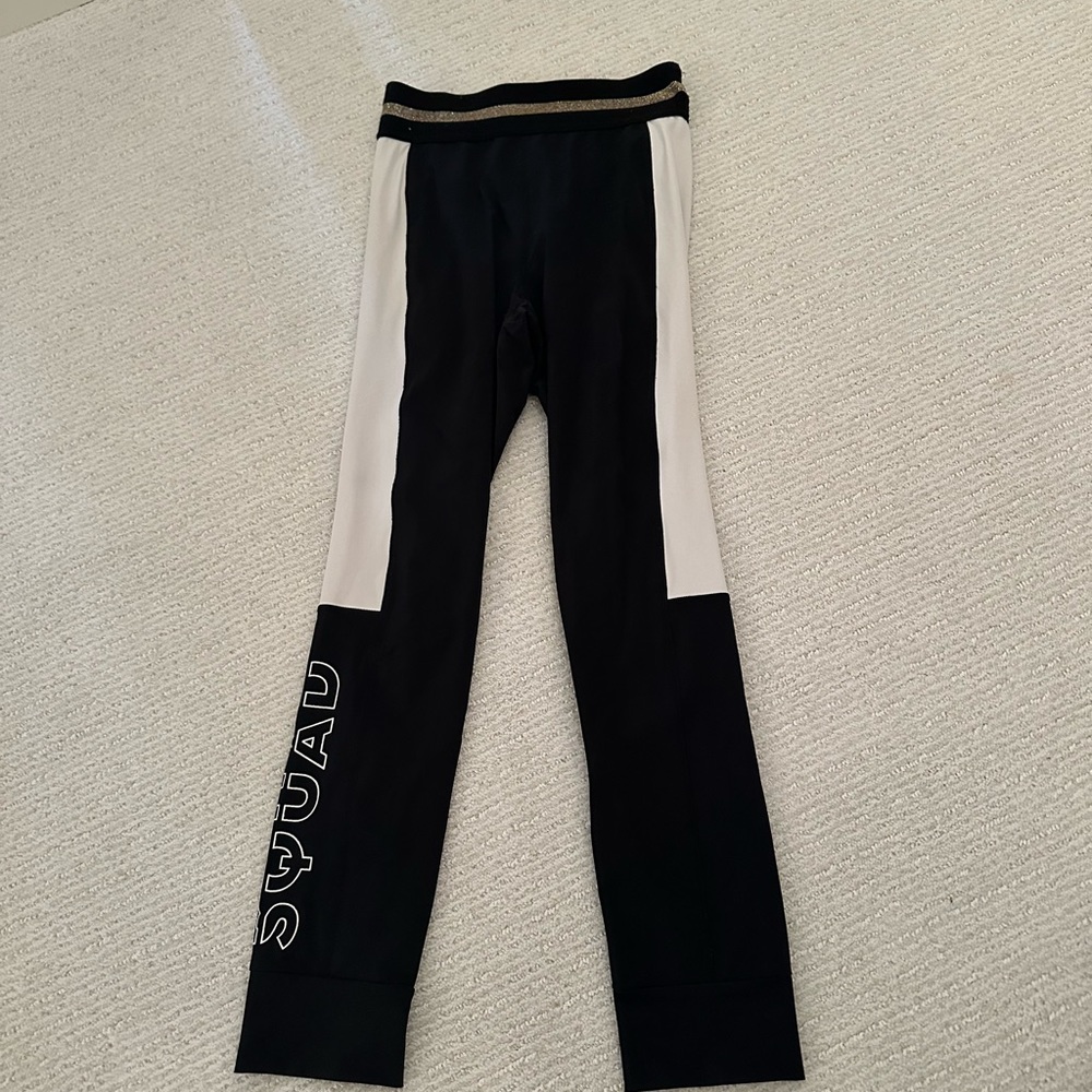 PE Nation size small black squad leggings. Has gold detail around waistline.